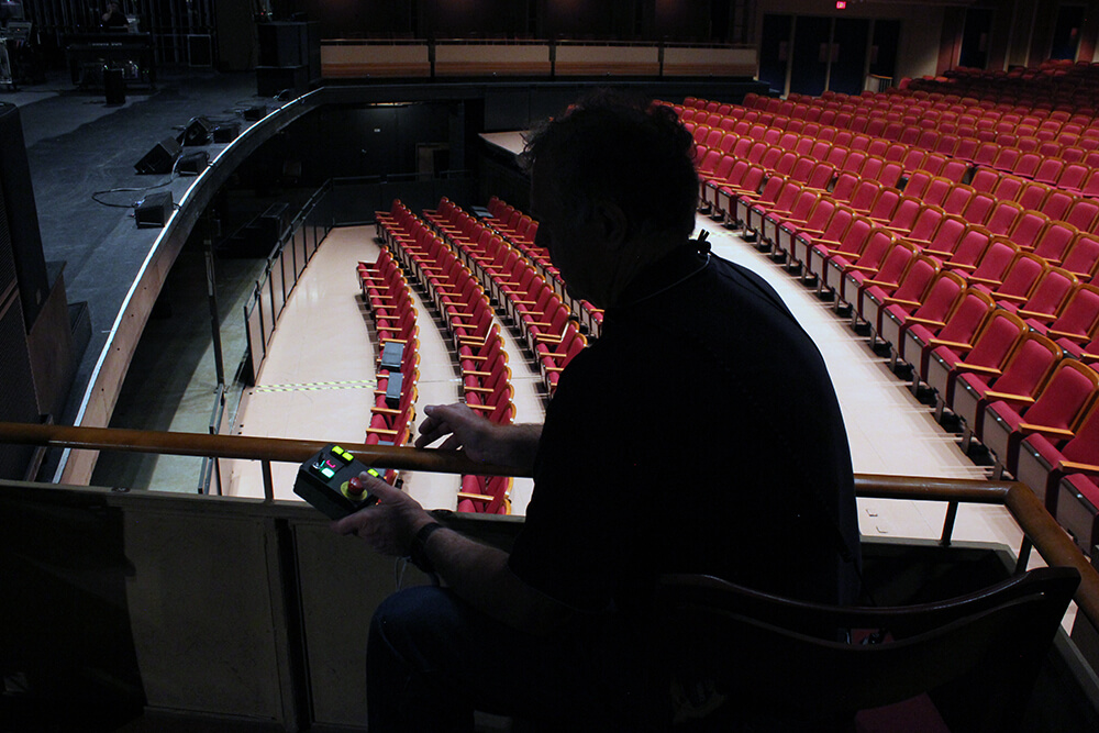 Jim using the elevator controls to lower the orchestra pit.