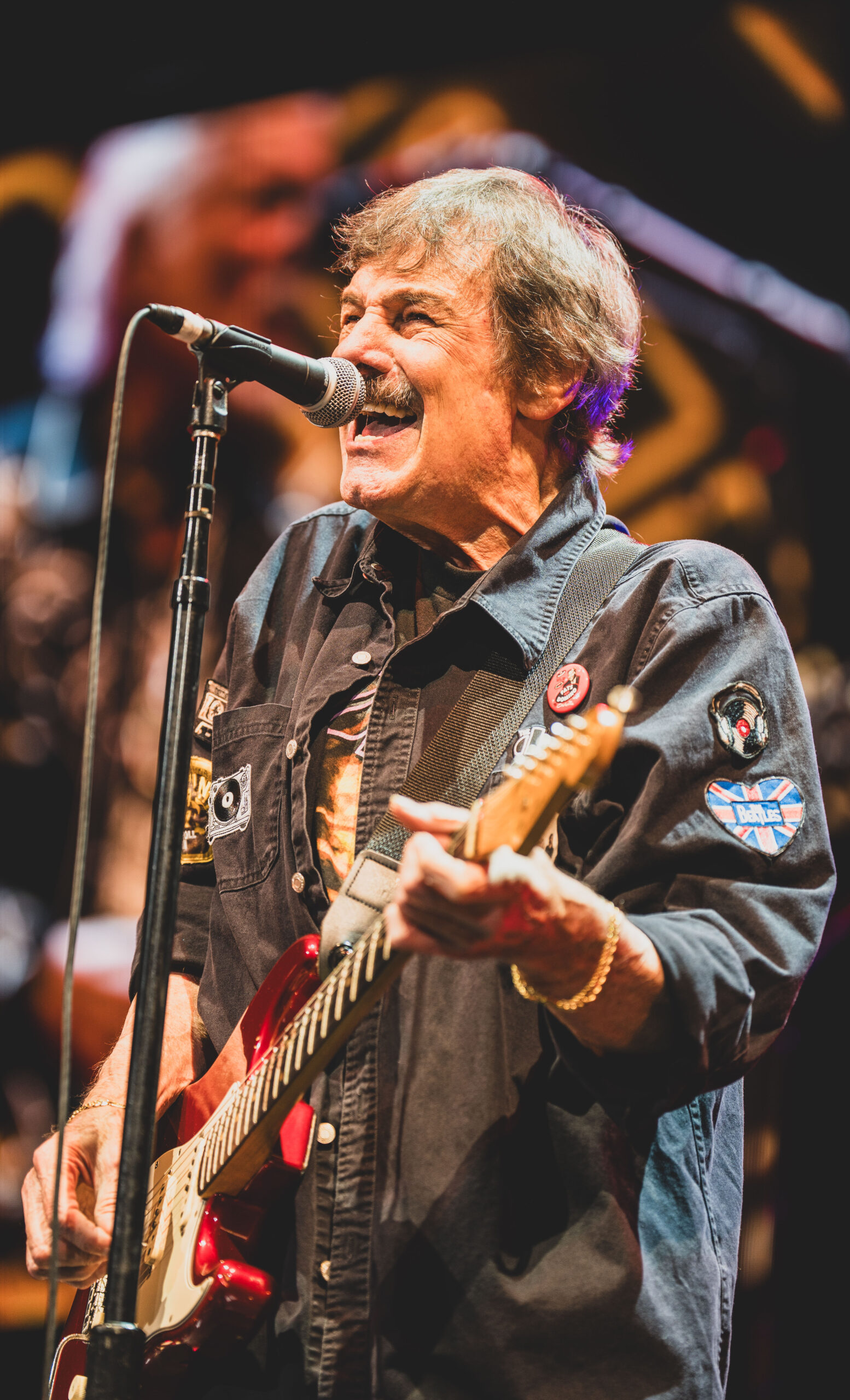 Burton Cummings performing with guitar